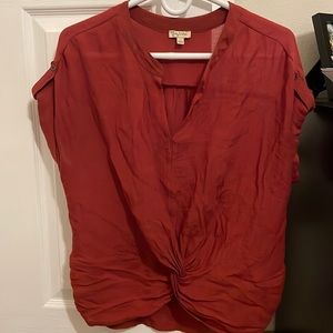 Size Small blouse, reddish orange color.